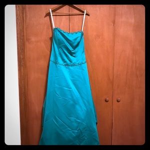 Teal prom dress with bustled back.
